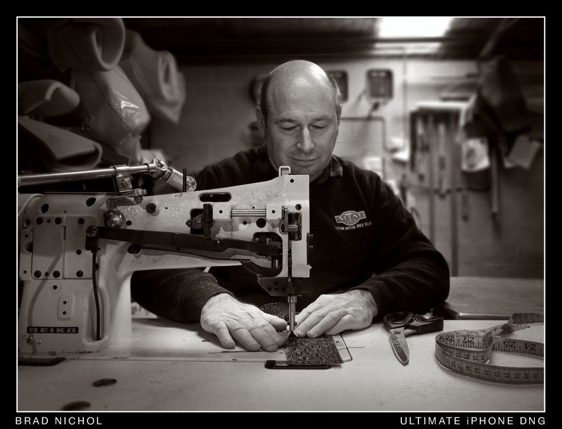 sewing leather material on industrial sewing machine.